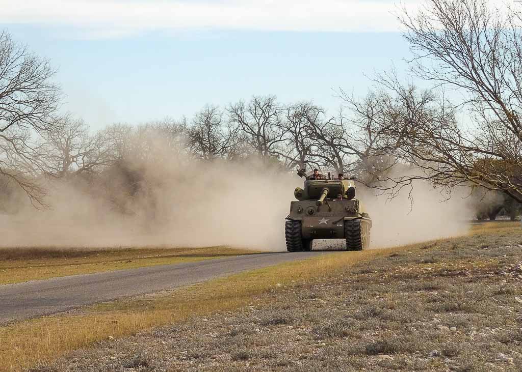 image: military tank driving toward you